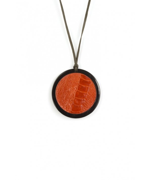 Black horn medallion pendant set with orange ostrich leather