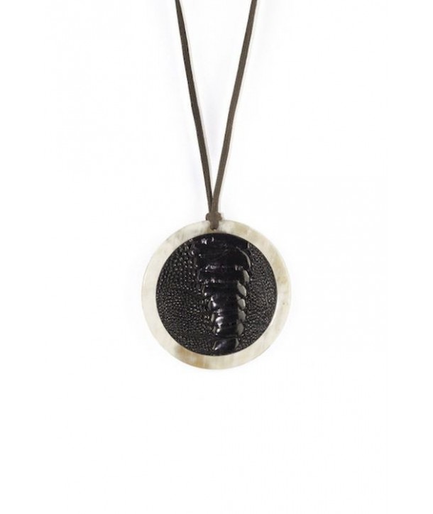 Blond horn medallion pendant set with black ostrich leather