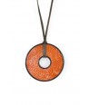 Round pendant in black horn set with orange ostrich leather