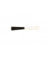 Butter knife with black horn handle and bone blade