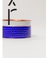 Hammered copper round bracelet with blue and white lacquer