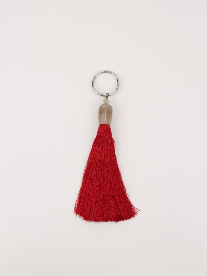 Keychain pompom horn and red thread 11cm