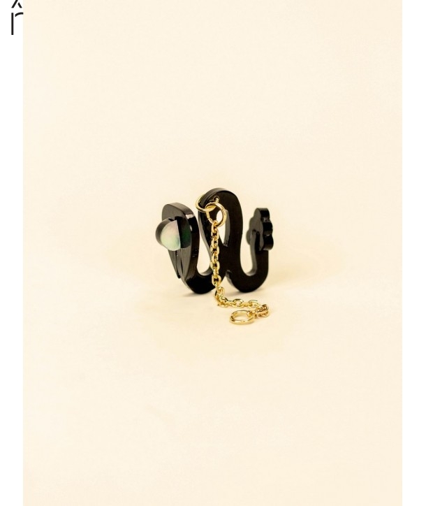 Snake ear charm in black horn and mother-of-pearl