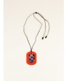 Oval geometric pendant with orange and indigo lacquer