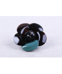 Black horn camellia brooch with celadon green lacquered petals